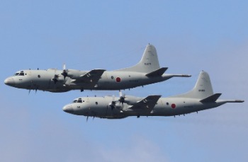 JMSDF P-3C Orions 5077 and 5088 doing a formation low pass at Shimofusa (photo: J. Thompson)