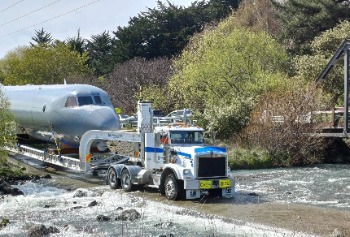 NZ4203 crossing a river on its way to the museum (photo: Air Force Museum of New Zealand)